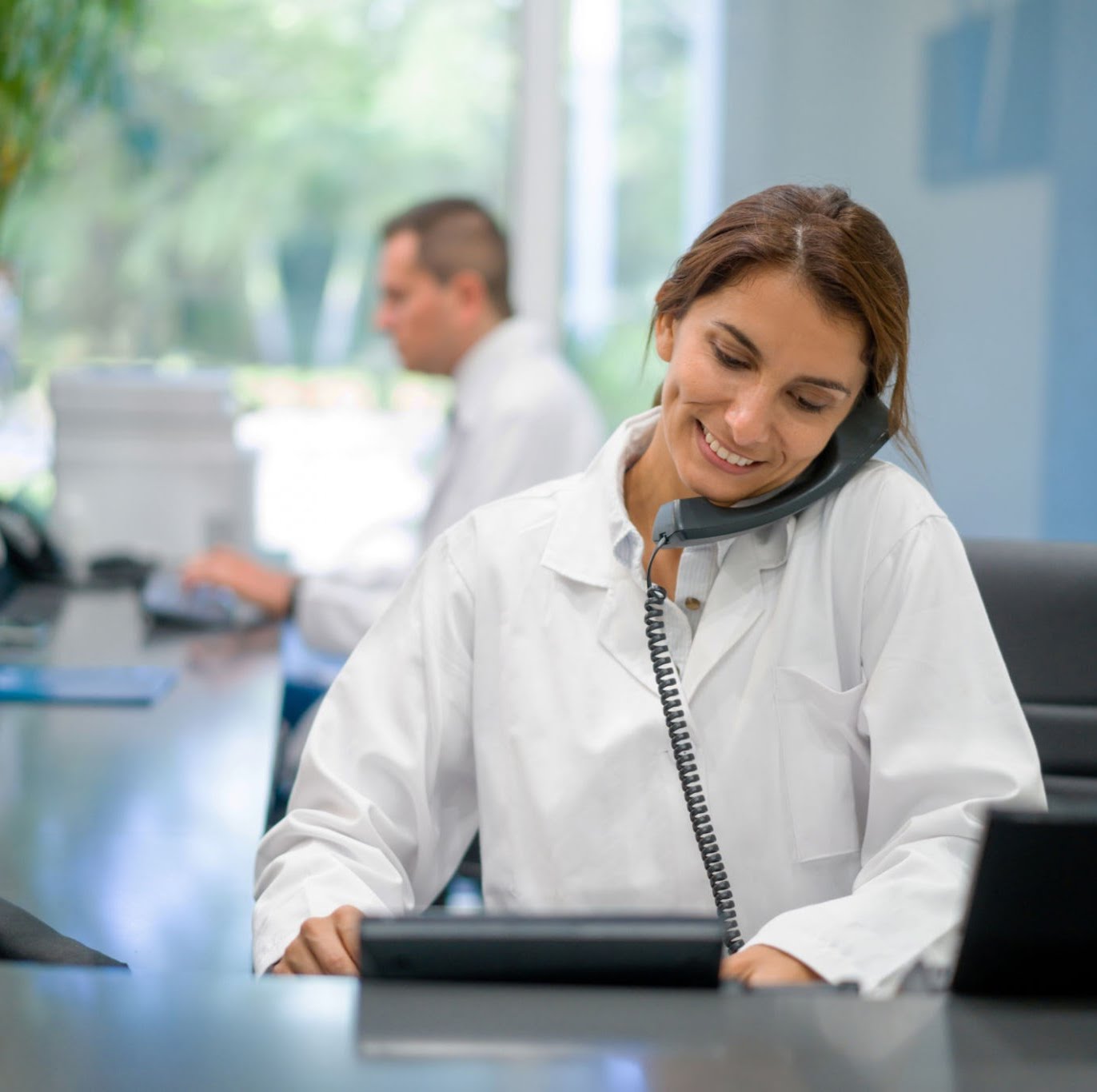 Professional receptionist on phone